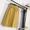 Jupes pour femmes Midi Longueur du genou Coréen Élégant Bouton Taille haute Jupe Femme Jupe d'école plissée 210730