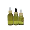 Couvercle en plastique en faux bois Bouteille en verre vert olive Emballage cosmétique Conteneurs rechargeables Flacons compte-gouttes en caoutchouc d'huile essentielle vide 5 ml 10 ml 15 ml 20 ml 30 ml 50 ml 100 ml