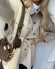 Cappotto vintage da tasca oversize beige Cappotto moda sottile manica lunga Fasce caldo elegante Capispalla famale Chic Top inverno 210521