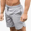 Uruchamianie spodenki 2022 Letnie Mężczyźni Średnie Talia Luźne Męskie Sporty Pięciopniowe Spodnie Fitness Sznurowanie Elastyczne Casual Suche