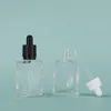 400 stks partij 30 ml glazen serum fles transparante cosmetische essentiële olie verpakking druppelaar container met veilige tamper deksels