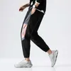 Jogging byxor män våren sommar utomhus sport lösa byxor 2021 nya panelade spliced ​​drawstring manliga trendiga sweatpants x0615