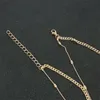 スタイリッシュなゴージャスなYタイプの長ペンダントシンプルな二重楕円形ビードチェーンゴールデン温度鎖骨ネックレスの女性ネックレスが積み重ねられています