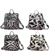 PU Läder Cow Zebra Tryck Kvinnors ryggsäck utomhusresor fritid axelväska med gitarrband crossbody