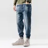 Jeans da uomo Moda Streetwear Uomo Retro Blu Spliced Designer Denim Cargo Pantaloni Harem Loose Fit Pantaloni da jogging Hip Hop