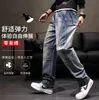 Trend Baggy Dżinsy Mężczyźni Casual Denim Patchwork Cargo Spodnie Streetwear Spodnie Plus Rozmiar Proste Kieszenie Elastyczne Waist Clohting