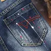 Jeans Masculinos 2021 Verão Marca de Verão Tendência Moda Reta Denim Shorts Bolsos Clássicos Bolos Rasgados Print Pintura Juvenil Algodão