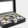 Scatole per orologi Custodie per scatole da 12 slot con coperchio in vetro Velluto grigio Contenitori in legno In pelle sintetica in fibra di carbonio Hele22