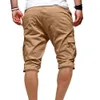 Hommes élégants pantalons courts d'été couleur unie multi-poches cordon cinquième pantalon shorts de plage 2021 printemps été vêtements pour hommes Y0408