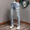 Style coréen mode hommes jean bleu clair patchs de broderie déchiré Denim pantalon Streetwear élastique coton mince pantalon de créateur