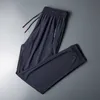 Summer Ice Silk Sweatpants Men Quick Dry Breathable Loose Fitness Belted Straight Pants Slim Stretch Cool Casual Men Pants 7XL Y0811