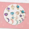 est 50pcs / lot glitter emalj legering charms mode jord boll hjärta saturn måne stjärna form guld ton olja droppe mini pendants