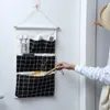 Opbergdozen bakken muur ophangende linnen stof organizer speelgoed decor zak zakje zonsondergenokten container besparing ruimte groene woning benodigdheden