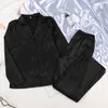 Hechan Black Sleepwear Kvinna Satin 2 Piece Set Solida Kvinnor Pyjamas Lösa Byxor Casual Home Suit Set Nightwear Winter Pocket 210809