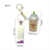Ny Keychain Cartoon Cat Car Keychain Mini Milk Tea Cup Flytande Crystal Quicksand Sequin Key Ring Bag Pendant för kvinnor G1019