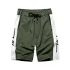 Mannen actieve atletische prestaties losse pasvorm shorts met pocket masculino katoen elastische taille trekkoord korte broek DK09 210527