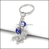 سلاسل المفاتيح إكسسوارات الموضة 2021 الشر التركي عيون محظوظ Blue Fatima Hand Charm Trinket Key Chain Vintage Keyring للرجال C314J