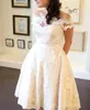 Anpassad storlek 1950-tal off-shoulder te-längd spets bröllopsklänning, vintage a-line elfenben brudklänning med korta ärmar