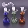 Nyaste Mini Glass Oil Rig Bong 10mm Kvinna Tjock Pyrex Bägare Travel Glas Vatten Bongs DAB Riggar för rökning med silikon halm