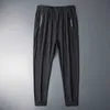 Summer Ice Silk Sweatpants Men Quick Dry Breathable Loose Fitness Belted Straight Pants Slim Stretch Cool Casual Men Pants 7XL Y0811