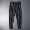 Pantaloni sportivi da uomo in seta estiva da uomo Quick Dry traspirante allentato Pantaloni dritti con cintura fitness Slim Stretch Pantaloni da uomo casual cool 7XL Y0811