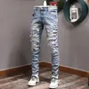 Calças jeans masculinas skinny fit com painel e elástico em azul 295C