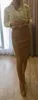 Zimowe koreańskie spódnice skórzane pu kobiety wysoka talia prosta midi seksowna spódnica plus size solidna podział 10091 220221