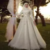 Vestidos de boda de dubai árabe perlas de cristal apliques una línea vestidos de novia a personalizados mangas largas de cuello alto hecha con túnica de marie