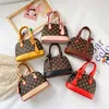 Moda niñas bolsos impresos padres niños floral mini portátil accesorios de concha mensajero bolsa niños mujeres cadena un hombro bolsos F137