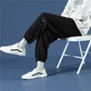 Męskie spodnie E-BAIHUI jesienne proste spodnie dresowe jednokolorowe sportowe męskie modne luźne proste nogawki multi-button beamed casualowe spodnie