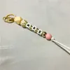 2022 Nouvelle fête des mères Cadeau Leopard Print Silicone Wood Bead Mama Keychain Keychain pour maman