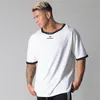 Męskie koszulki 2021 patchworkowa luźna koszulka męska Gym Fitness kulturystyka bawełniana koszulka męska koszulka z krótkim rękawem topy letni trening sportowy