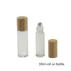 Bouteilles à rouler de 10ML, vente en gros, bouteilles à bille en acier, huile de Massage/Essence, récipient de brillant à lèvres, bouteilles en verre de bambou
