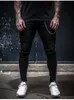 Mode casual striped skinny jeans män sträcker smal passform penna byxor jogger hip hop streetwear harem svart denim man byxor