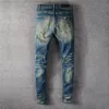 Мужские джинсы дизайнер Джинс мужчина оптом бренд случайные синие рваные отверстия скейтборд Сращивание прямых мотоциклов Biker Щить тонкий хип-хоп джинсовые тощие брюки
