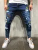 Męskie dżinsy Europejskie i Amerykańskie Four Seasons Style Hip-Hop High-End Tight-Dopasowane Zgrywanie Feet Spodnie Odznaka