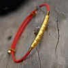 Bracelets porte-bonheur bouddhiste tibétain nœuds faits à la main fil créatif perles de cuivre irrégulières rouge noir corde tirant Bracelet pour femmes hommes