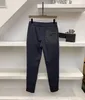 2021 Upadek / Zima Nowy Mężczyzna Designer Spodnie High-End Silky Stretch Mężczyźni Slim Małe Stopy Luksusowe Dorywcze Spodnie