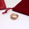 Mode designer män kvinnor tre-ring trefärg rostfritt stål ring rose guld splicing par ringar med låda