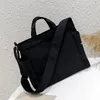 2021 nuevo bolso de hombro de moda, bolso de lona de alta calidad para mujer, bolsos de mensajero de dos colores en blanco y negro para mujer, bolsos de compras