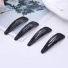 snap hair clips black