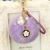 Lavendel päls boll nyckelkedja smycken rhinestone charms blomma klöver nyckelringar ringar hållare tillbehör mode kvinnor imitation pärlväska hänge bilar nyckelring gåva
