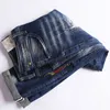 Amerikaanse streetwear mode mannen jeans elastische vernietigde gescheurde borduurwerk patchwork designer hiphop slanke punk broek
