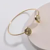 Vendi braccialetti Druzy in resina ovale con irregolarità d'oro per braccialetti da donna