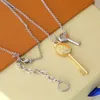 Europe America New Style Men Lady Women Gold and Silvercolour Hardware Engraved V Initials Double Key Pendant Long Necklace MP286984544