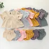 INS Vestiti per bambini da bambina Set di due pezzi Estate Tinta unita O-collo Ruffles + Short 100% cotone Set di abbigliamento per bambini