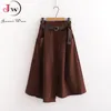 Mulheres saias casuais primavera e outono sólido cintura alta bolsos irregulares midi moda simples elegante saia faldas w220314
