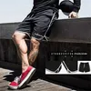 Sommar varumärke mesh snabba torra fitness shorts män gym knä längd kroppsbyggnad aktiva joggers träning sweat short byxor 210714