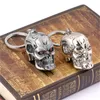 Keychains H&F 12pcs/lot Movie Terminator Keychain 3D Skull Metal Head Shape Logo Key Chain Holder Ring Car Pendant Accessory Chaveiro