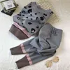 Conjuntos de 2 piezas de punto con estampado de leopardo suelto informal para mujer, jerséis con cuello en V, sudaderas y pantalones Harem de Color en contraste, traje 211105